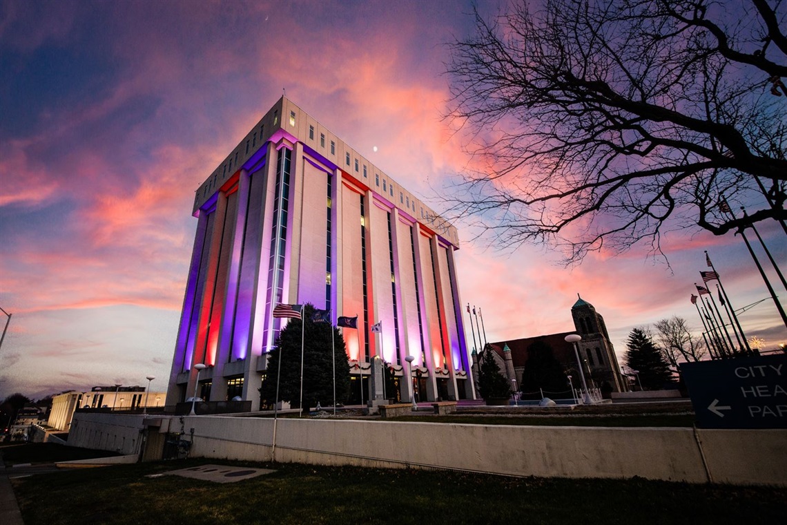 The City Hall municipal building illuminated in celebration of the Kansas City Chiefs and Kansas City Royals.