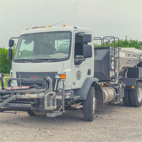 Photograph of a spray pothole patcher in Kansas City, Kansas